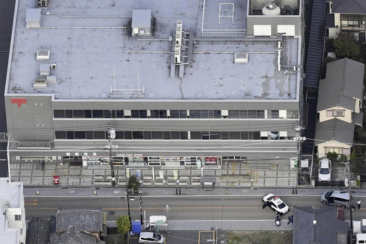 A gunman holed up at a Japanese post office may be linked to an earlier shooting at a hospital